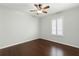 Neutral bedroom featuring a modern ceiling fan and beautiful shuttered windows at 2565 Albion Ave # 2, Orlando, FL 32833