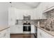 Well-lit kitchen showcases modern appliances, granite countertops, and stylish cabinets at 2565 Albion Ave # 2, Orlando, FL 32833