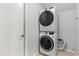 A stacked washer and dryer appliance in a small laundry space at 2565 Albion Ave # 2, Orlando, FL 32833