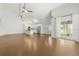 An airy living room boasts sleek flooring, an open layout, and natural light at 2565 Albion Ave # 2, Orlando, FL 32833