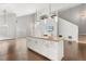 Open-concept living space featuring a modern kitchen island and high ceilings at 2565 Albion Ave # 2, Orlando, FL 32833