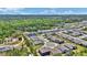 Picturesque aerial view of a residential community featuring beautiful homes, scenic ponds, and lush wooded surroundings at 2628 Cedar Shake Ct, Oviedo, FL 32765