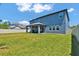Exterior of home shows spacious backyard and covered patio for entertaining at 2628 Cedar Shake Ct, Oviedo, FL 32765