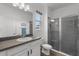 Modern bathroom with glass-enclosed shower, vanity with sink, and neutral color scheme at 2628 Cedar Shake Ct, Oviedo, FL 32765