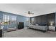 Well-lit bedroom features two beds, a black dresser, and a neutral color palette at 2628 Cedar Shake Ct, Oviedo, FL 32765