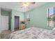 Bright bedroom with two windows, ceiling fan, closet, and comfortable furnishings at 2628 Cedar Shake Ct, Oviedo, FL 32765