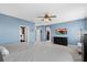Bright bedroom featuring a dresser and view into the closets and main areas at 2628 Cedar Shake Ct, Oviedo, FL 32765