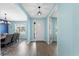 Welcoming foyer with hardwood floors, neutral paint, and an open view of the dining room at 2628 Cedar Shake Ct, Oviedo, FL 32765