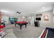 Expansive game room featuring a pool table and several arcade games for entertainment at 2628 Cedar Shake Ct, Oviedo, FL 32765