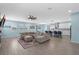 Expansive open layout with a modern kitchen, comfortable living area, and sliding glass doors to the patio at 2628 Cedar Shake Ct, Oviedo, FL 32765