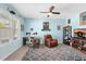 Comfortable home office with natural light, a ceiling fan, plush rug, and dedicated workspace at 2628 Cedar Shake Ct, Oviedo, FL 32765