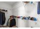 Organized walk-in closet with shelving and hanging racks at 2628 Cedar Shake Ct, Oviedo, FL 32765