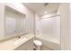 Bright bathroom featuring a shower-tub combination, and a granite countertop sink at 264 Towns Cir, Haines City, FL 33844