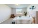 Comfortable bedroom featuring carpet, neutral walls, lots of natural light, and a decorative mirror display at 264 Towns Cir, Haines City, FL 33844