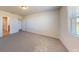 This vacant bedroom boasts ample natural light, plush carpeting, and easy access to a bathroom, offering a flexible space at 264 Towns Cir, Haines City, FL 33844