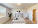 Cozy bedroom featuring a comfortable bed, soft carpet, and a view from the window at 264 Towns Cir, Haines City, FL 33844