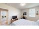 Comfortable bedroom featuring a desk, TV, and a view into the hallway at 264 Towns Cir, Haines City, FL 33844