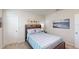 Comfortable bedroom with serene decor, beach themed art, and cozy bedding at 264 Towns Cir, Haines City, FL 33844