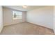 An empty bedroom is bright, featuring a large window and plush carpeting, ready for personalization to create a perfect sanctuary at 264 Towns Cir, Haines City, FL 33844