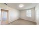 Bright bedroom with a neutral color scheme, plush carpet, and ample natural light from the window at 264 Towns Cir, Haines City, FL 33844