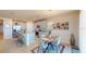 Inviting dining area with a modern table, stylish chairs, and a view of the well-equipped kitchen at 264 Towns Cir, Haines City, FL 33844