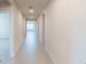 Bright hallway features modern lighting and light, wood-look flooring at 264 Towns Cir, Haines City, FL 33844