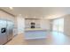 Spacious kitchen with stainless steel appliances, a large island, and plenty of cabinet space at 264 Towns Cir, Haines City, FL 33844