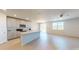 Bright kitchen with stainless appliances, a center island, and an adjacent dining area, perfect for entertaining at 264 Towns Cir, Haines City, FL 33844