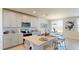 Charming kitchen with an island, stainless steel appliances, and a cozy dining area at 264 Towns Cir, Haines City, FL 33844