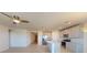 Open kitchen layout featuring stainless steel appliances, a central island, and seamless connectivity to adjacent living spaces at 264 Towns Cir, Haines City, FL 33844