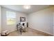 Bright office space with a large window, desk, and a view of the outdoors, ideal for working from home at 264 Towns Cir, Haines City, FL 33844