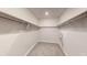 Spacious walk-in closet features shelving and carpeted floor at 264 Towns Cir, Haines City, FL 33844
