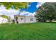 Large backyard showcasing a well-maintained lawn, offering ample space for outdoor activities at 2650 Einwood Dr, Kissimmee, FL 34758