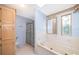 Bathroom boasts a soaking tub, separate shower, and blue accents for a calming atmosphere at 2650 Einwood Dr, Kissimmee, FL 34758