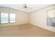 Large bedroom with three windows allowing ample natural light and ceiling fan at 2650 Einwood Dr, Kissimmee, FL 34758