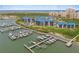 A high angle view of the condo community highlighting the boat docks and mature landscaping at 2700 N Peninsula Ave # 215, New Smyrna Beach, FL 32169
