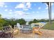 A communal seating area with a fire pit and kayaks near the marina at 2700 N Peninsula Ave # 215, New Smyrna Beach, FL 32169