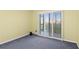 This bedrom has sliding doors that lead to a balcony at 2700 N Peninsula Ave # 215, New Smyrna Beach, FL 32169