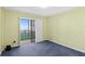 A serene bedroom with sliding doors lead to balcony at 2700 N Peninsula Ave # 215, New Smyrna Beach, FL 32169