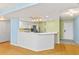 Kitchen featuring white cabinetry, stainless appliances, and a breakfast bar at 2700 N Peninsula Ave # 215, New Smyrna Beach, FL 32169