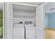 An inside laundry closet with a white washer and dryer at 2700 N Peninsula Ave # 215, New Smyrna Beach, FL 32169
