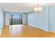 Bright living room with sliding doors to a patio overlooking the pool at 2700 N Peninsula Ave # 215, New Smyrna Beach, FL 32169