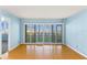 Light-filled living area featuring plank floors and sliding doors for a seamless indoor-outdoor flow at 2700 N Peninsula Ave # 215, New Smyrna Beach, FL 32169