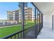 Scenic view of a nearby resort from a screened-in patio at 2700 N Peninsula Ave # 215, New Smyrna Beach, FL 32169