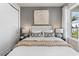 Comfortable bedroom with ample natural light, stylish furnishings, and vinyl plank flooring at 2749 Serenity Meadow Dr, Kissimmee, FL 34744