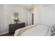 Bedroom featuring modern decor, a cozy bed, and neutral color tones at 2749 Serenity Meadow Dr, Kissimmee, FL 34744