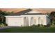 Charming home with a two-car garage, covered entry, and well-maintained landscaping at 2749 Serenity Meadow Dr, Kissimmee, FL 34744