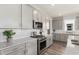 Kitchen boasts stainless steel appliances, white subway tile backsplash, and plenty of cabinet storage at 2749 Serenity Meadow Dr, Kissimmee, FL 34744