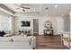 Spacious living room with modern decor and a view of the kitchen at 2749 Serenity Meadow Dr, Kissimmee, FL 34744