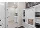 Mudroom featuring built-in storage with seating and access to the laundry room at 2749 Serenity Meadow Dr, Kissimmee, FL 34744